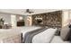 Spacious main bedroom with a stone fireplace, seating area, and an ensuite bathroom at 8316 Hewlett Rd, Sandy Springs, GA 30350