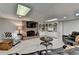 Finished basement boasts a brick fireplace, custom built-ins, and ample seating at 10195 Brier Mill Ct, Alpharetta, GA 30022