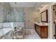 Modern bathroom with marble-tiled floors, frameless glass shower, and sleek vanity at 10195 Brier Mill Ct, Alpharetta, GA 30022