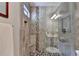Modern bathroom featuring a tiled walk-in shower with a glass door and stone floor at 10195 Brier Mill Ct, Alpharetta, GA 30022