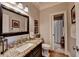 Bathroom with granite countertops, a dark wood vanity, and tiled floors at 10195 Brier Mill Ct, Alpharetta, GA 30022