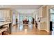 Bright dining area with arched windows, a modern chandelier, and a cozy space for Gathering meals and entertaining guests at 10195 Brier Mill Ct, Alpharetta, GA 30022