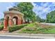 Brick gazebo with manicured landscaping at the Oxford Mill neighborhood entrance at 10195 Brier Mill Ct, Alpharetta, GA 30022
