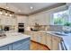 Well-equipped kitchen with stainless steel appliances, tiled backsplash, and white countertops for a modern, clean look at 10195 Brier Mill Ct, Alpharetta, GA 30022