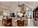 Spacious living room features a stone fireplace, vaulted ceilings, and large windows that let in plenty of natural light at 10195 Brier Mill Ct, Alpharetta, GA 30022