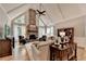Bright living room with vaulted ceilings, stone fireplace, and large windows at 10195 Brier Mill Ct, Alpharetta, GA 30022