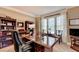 Comfortable office with custom desk, plush chair, and bright lighting at 10195 Brier Mill Ct, Alpharetta, GA 30022