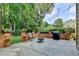 Spacious outdoor patio with brick accents, grill, and string lights, perfect for entertaining at 10195 Brier Mill Ct, Alpharetta, GA 30022