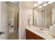 Bathroom featuring a vanity with mirror and a view into the adjacent bathroom at 1382 Murrays Loch Nw Pl, Kennesaw, GA 30152
