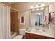 Bathroom with a single sink vanity, shower-tub combo, and neutral finishes at 1382 Murrays Loch Nw Pl, Kennesaw, GA 30152