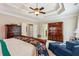 Bright bedroom with trey ceilings, hardwood furniture, and comfortable seating at 1382 Murrays Loch Nw Pl, Kennesaw, GA 30152