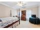 Cozy bedroom featuring a four-poster bed, desk, and natural light at 1382 Murrays Loch Nw Pl, Kennesaw, GA 30152