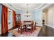 Dining room with chandelier, classic furnishings, and large windows offering natural light at 1382 Murrays Loch Nw Pl, Kennesaw, GA 30152