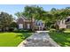 Charming brick home with well-maintained lawn, mature trees, and traditional architectural details at 1382 Murrays Loch Nw Pl, Kennesaw, GA 30152