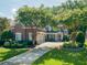 A charming brick house with a well-manicured lawn and mature trees at 1382 Murrays Loch Nw Pl, Kennesaw, GA 30152