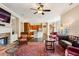 Open living area with a fireplace and seamless transition to the kitchen and dining space at 1382 Murrays Loch Nw Pl, Kennesaw, GA 30152