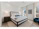 This bedroom offers ample natural light, neutral decor, and a cozy rug at 1494 Red Fox Ne Dr # D, Atlanta, GA 30306
