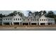 New townhouse construction featuring unfinished garages and gray siding at 158 Bluffington Way, Marietta, GA 30066