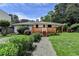 Backyard has a wooden deck, mature trees, and lovely landscaping at 4237 Rickenbacker Ne Way, Atlanta, GA 30342