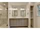 Elegant bathroom features double vanities and a spacious glass-enclosed shower at 4237 Rickenbacker Ne Way, Atlanta, GA 30342