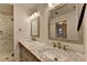 Elegant bathroom with marble countertops, double sinks, and a glass-enclosed shower at 4237 Rickenbacker Ne Way, Atlanta, GA 30342