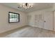 Spacious bedroom with hardwood floors, modern lighting, and double closets at 4237 Rickenbacker Ne Way, Atlanta, GA 30342