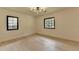 Well-lit bedroom featuring hardwood floors, natural light, and modern lighting fixtures at 4237 Rickenbacker Ne Way, Atlanta, GA 30342
