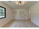 Bright bedroom with hardwood floors, modern lighting, and double closets at 4237 Rickenbacker Ne Way, Atlanta, GA 30342