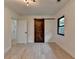 Well-lit bedroom featuring a unique barn door and hardwood floors at 4237 Rickenbacker Ne Way, Atlanta, GA 30342