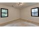 Bright bedroom with hardwood floors, black window frames and modern ceiling light at 4237 Rickenbacker Ne Way, Atlanta, GA 30342
