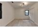 Bright bedroom showcasing hardwood floors, modern lighting, and windows at 4237 Rickenbacker Ne Way, Atlanta, GA 30342