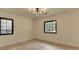 Spacious bedroom with hardwood floors, modern lighting, and large windows offering ample natural light at 4237 Rickenbacker Ne Way, Atlanta, GA 30342