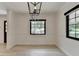 Bright dining room with modern light fixture and natural light at 4237 Rickenbacker Ne Way, Atlanta, GA 30342