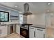 Modern kitchen features stainless steel appliances, granite countertops, and sleek white cabinetry at 4237 Rickenbacker Ne Way, Atlanta, GA 30342
