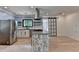 Modern kitchen with stainless steel appliances, floral island, and sliding glass door at 4237 Rickenbacker Ne Way, Atlanta, GA 30342