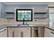 Close up of the kitchen area featuring stainless steel appliances, granite countertops, and floating shelves at 4237 Rickenbacker Ne Way, Atlanta, GA 30342
