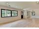 Bright and airy living room with large windows and hardwood floors at 4237 Rickenbacker Ne Way, Atlanta, GA 30342