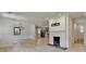 Bright living room with white brick fireplace and light hardwood floors at 4237 Rickenbacker Ne Way, Atlanta, GA 30342