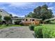 Charming single-story home featuring a spacious deck, landscaped yard, and gravel driveway at 4237 Rickenbacker Ne Way, Atlanta, GA 30342