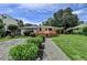 Charming single-story home featuring a spacious deck, landscaped yard, and gravel driveway at 4237 Rickenbacker Ne Way, Atlanta, GA 30342