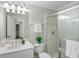 Bathroom with white fixtures, glass-enclosed shower, and neutral décor at 125 Franklin Pl, Atlanta, GA 30342