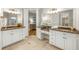 Elegant bathroom featuring dual vanities, granite countertops, and a spacious layout at 125 Franklin Pl, Atlanta, GA 30342