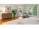 Comfortable bedroom featuring hardwood floors, natural light, and a stylish dresser at 125 Franklin Pl, Atlanta, GA 30342
