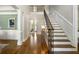 Inviting foyer showcasing hardwood floors, staircase with decorative iron railings, and elegant architectural details at 125 Franklin Pl, Atlanta, GA 30342