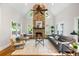 Spacious living room featuring a stone fireplace, vaulted ceilings, and large windows at 125 Franklin Pl, Atlanta, GA 30342