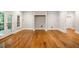 Open living room featuring hardwood floors and multiple windows for natural light at 125 Franklin Pl, Atlanta, GA 30342
