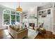 Inviting living room features a cozy fireplace, built-in shelving, and large windows providing natural light at 125 Franklin Pl, Atlanta, GA 30342