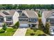 An aerial view showcasing the home's location in a peaceful neighborhood with mature trees at 1570 Ribbon Mill Sw Ln, Mableton, GA 30126