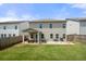 View of the large backyard with a covered patio, grill, and a hammock at 1570 Ribbon Mill Sw Ln, Mableton, GA 30126