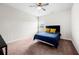 Cozy carpeted bedroom with ceiling fan and a window that lets in natural light at 1570 Ribbon Mill Sw Ln, Mableton, GA 30126